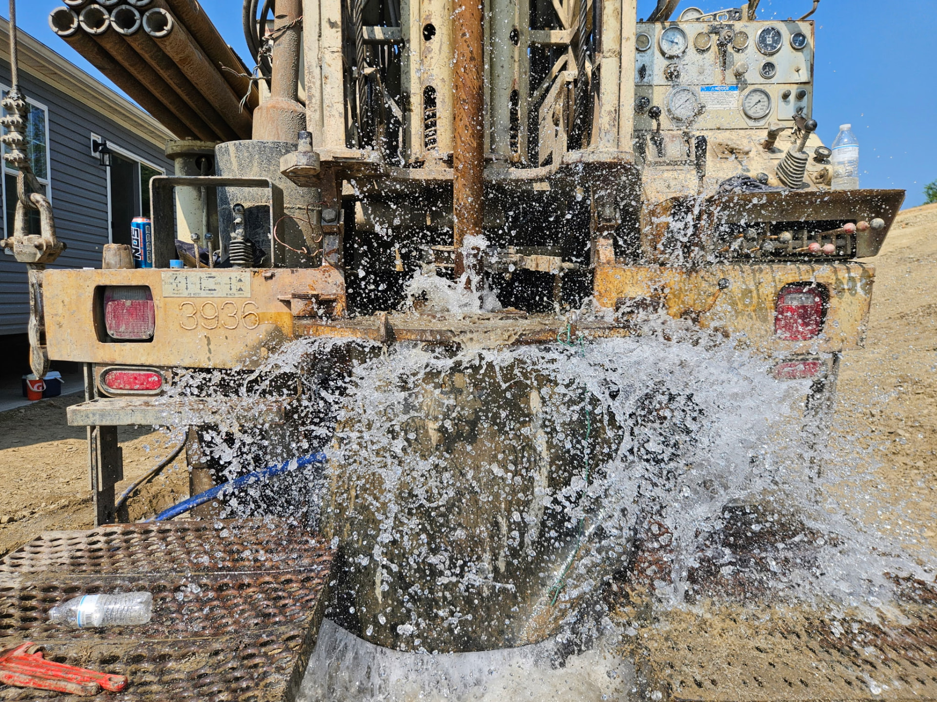 Water flowing from Burgess Drilling equipment during a new well project